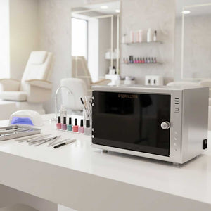 Professional UV sterilizer cabinet on nail salon workstation sanitizing manicure and beauty tools in a clean modern salon environment