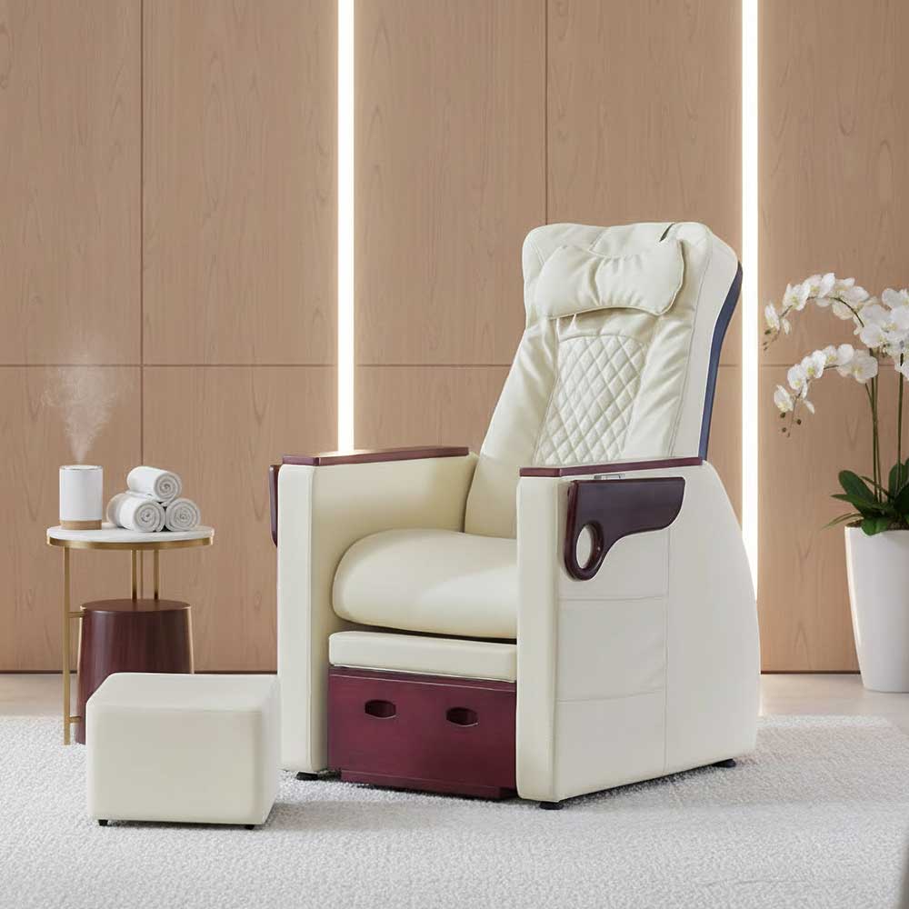 SalonAct Calvin Pedicure Chair No Plumbing Pedicure Spa featuring cream upholstered seating, quilted backrest, wood-accent armrests, and matching ottoman, displayed in a modern spa room.